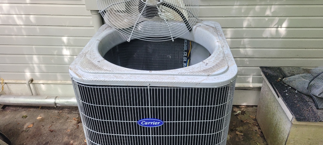 Marietta, GA - Performed AC Maintenance on 2 Carrier Condensing Units and removed all debris from bottom of condensing Units.  Marietta