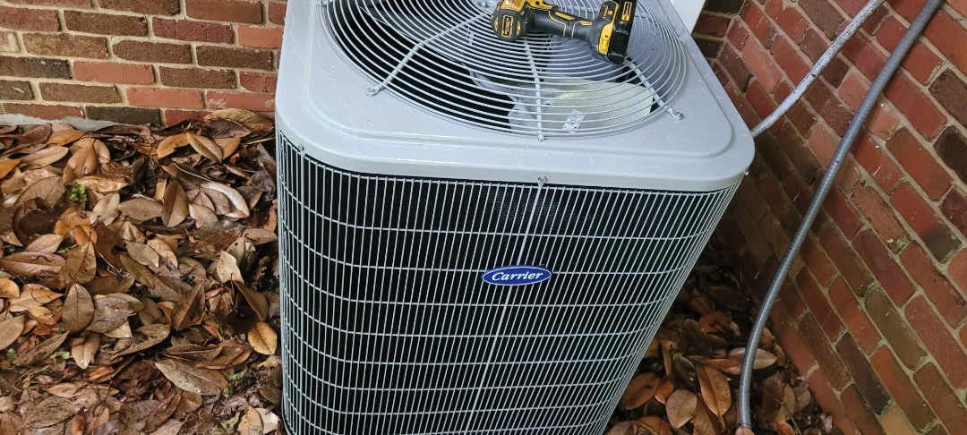 Kennesaw, GA - Performed AC Maintenance on a Carrier Condensing Unit and removed all debris from bottom of condensing unit.  Kennesaw 