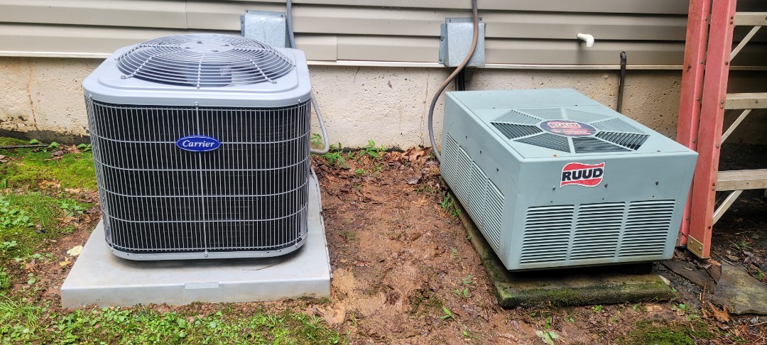 Dallas, GA - Performed AC Maintenance on a Carrier and a Rheem Condensing Units and removed all debris from bottom of units. Dallas