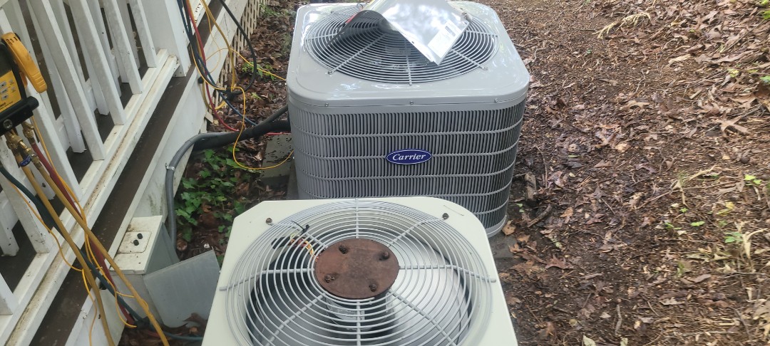 Marietta, GA - Performed AC Maintenance on a Carrier and a Payne Condensing Units and removed all debris from bottom of condensing Units.  Marietta 