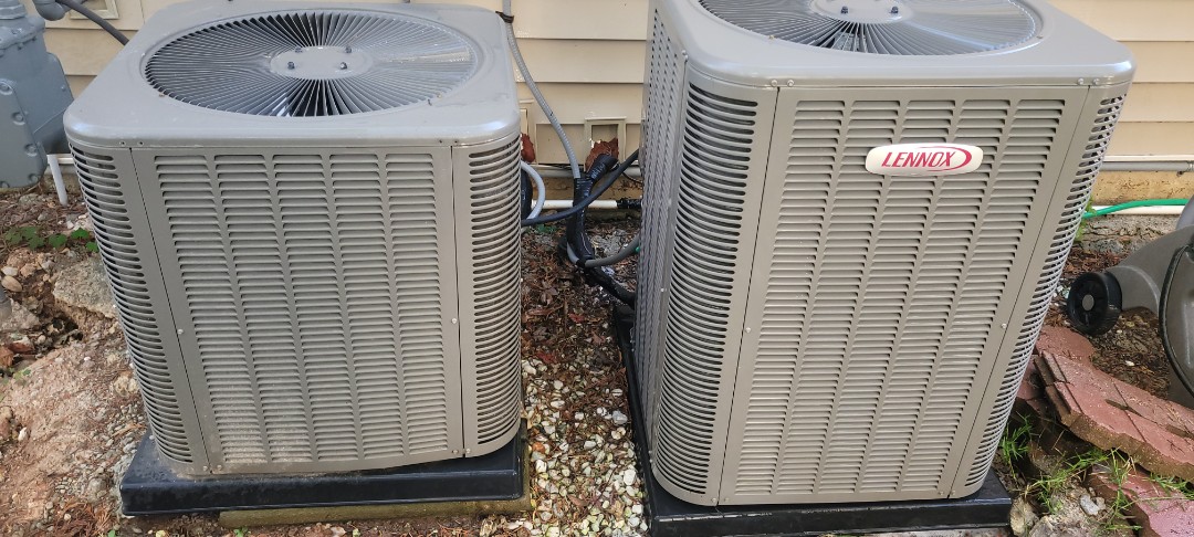 Marietta, GA - Performed AC Maintenance on 2 Lennox Condensing Units and removed all debris from bottom of condensing Units.  Marietta 