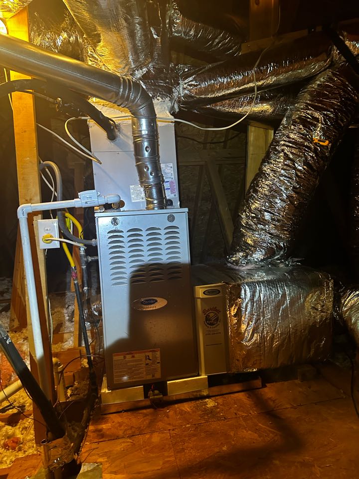 Smyrna, GA - Replaced existing mechanical system serving the upstairs with full Carrier Infinity system, including thermostat. Replaced both supply and return plenums and added an Aprilaire filter rack. Cut in a 10 inch return to the upstairs hallway and upsized two six inch supplies to 4 inch. Pressure tested and charged air conditioner with 410A refrigerant. Fired up heat and set gas pressures. Pulled new thermostat wire and outdoor unit low voltage wire. Also ran new PVC down the chase to basement. 