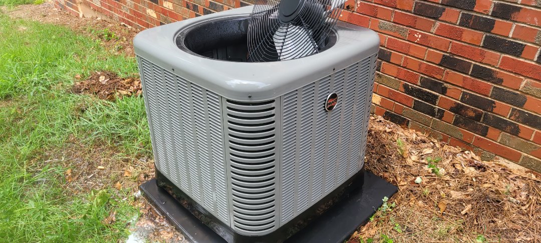 Marietta, GA - Performed AC Maintenance on a Rheem Condensing Unit and removed all debris from bottom of condensing unit.  Marietta 