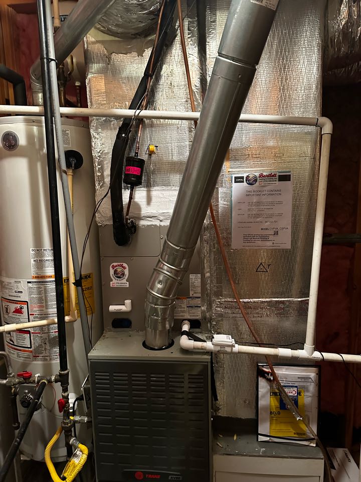 Marietta, GA - Replaced existing cooling system serving the upstairs with new Carrier 2.5 ton Puron condenser and matching evaporator coil. Left existing condensate pump and a new one for backup. Charged air conditioner with 410A refrigerant and checked pressures.  Checked drainage and ensured all condensate safeties are working. Checked Delta T in cooling. Checked heat. System is working as needed. Thank you for choosing Bartlett Heating and Cooling. 