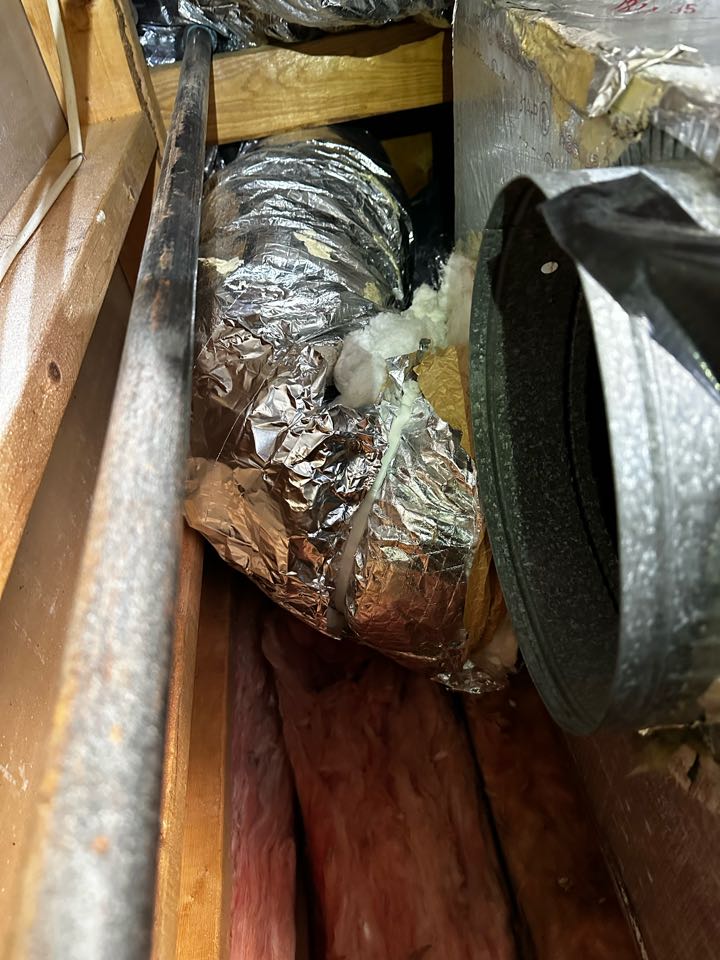 Smyrna, GA - Installed 5 manual dampers and repaired torn duct work. Fixed a pinched off duct by using a hard pipe elbow. Balanced air flow with dampers and registers best I can. Kitchen area seems to be getting the least air flow no matter the adjustments made. I think the adjustments made will help. Recommend a camera inspection of duct work to see if it is torn in the inaccessible areas. 