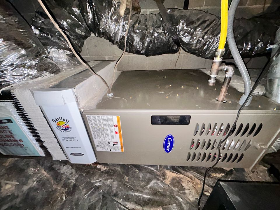 HVAC heating maintenance on Carrier furnace in Smyrna. Replaced Aprilaire media filter and low run capacitor. 