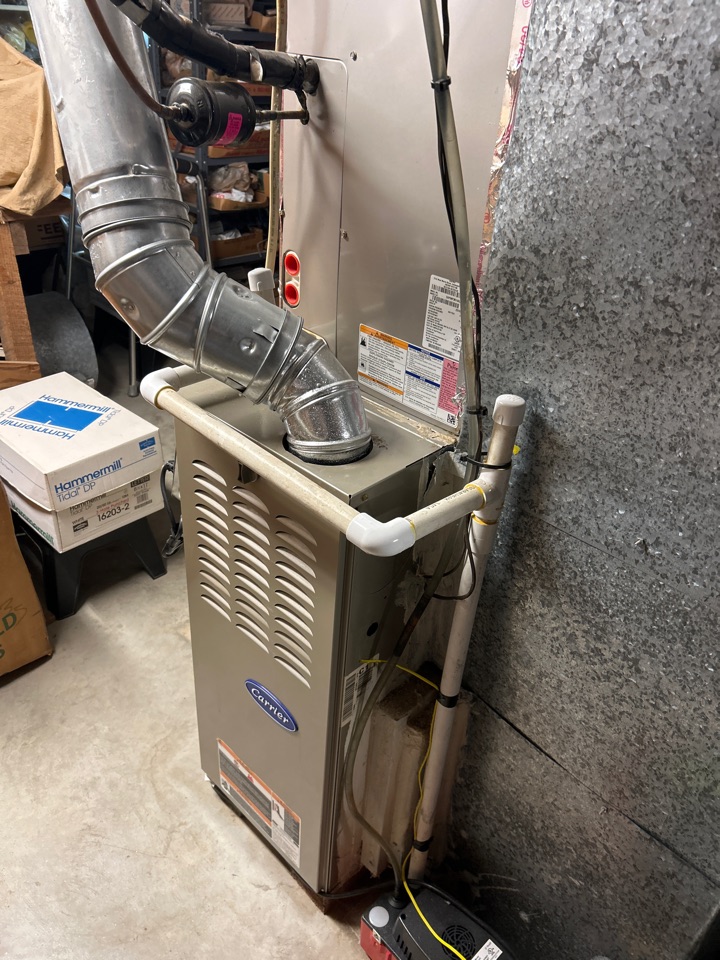 HVAC heating maintenance on Carrier furnace in Smyrna.