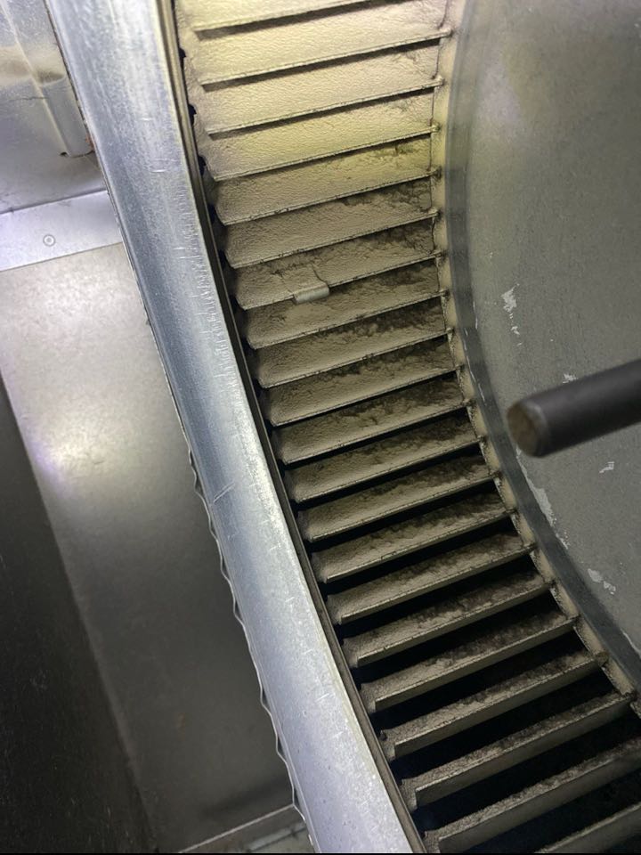 Blower wheel in need of chemical cleaning.