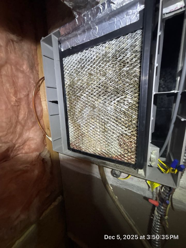 Water leaking into emergency drain pan found that the water panel for the humidifier clogged. 