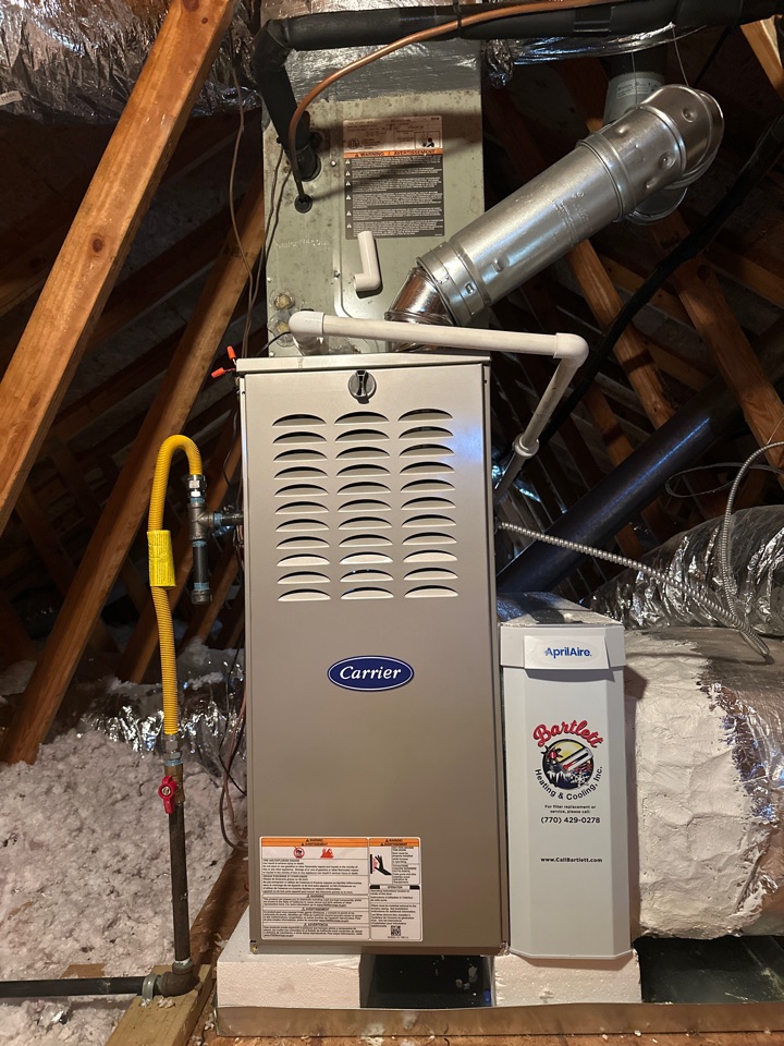 Removed and replaced upstairs furnace install new carrier comfort DLX 45,000 BTU gas furnace installed new April air media filter