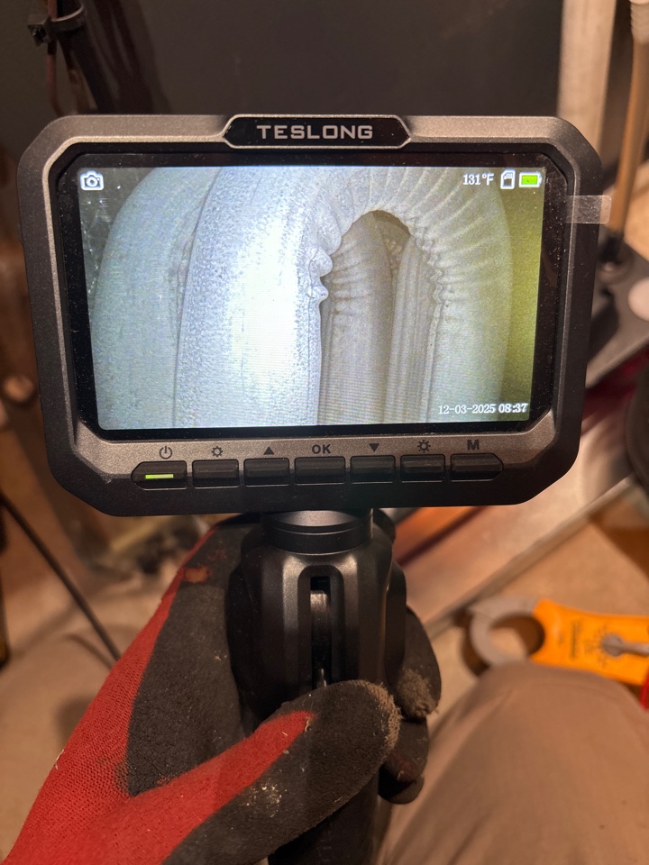 Inspecting the heat exchanger on a Fall Maintenance 