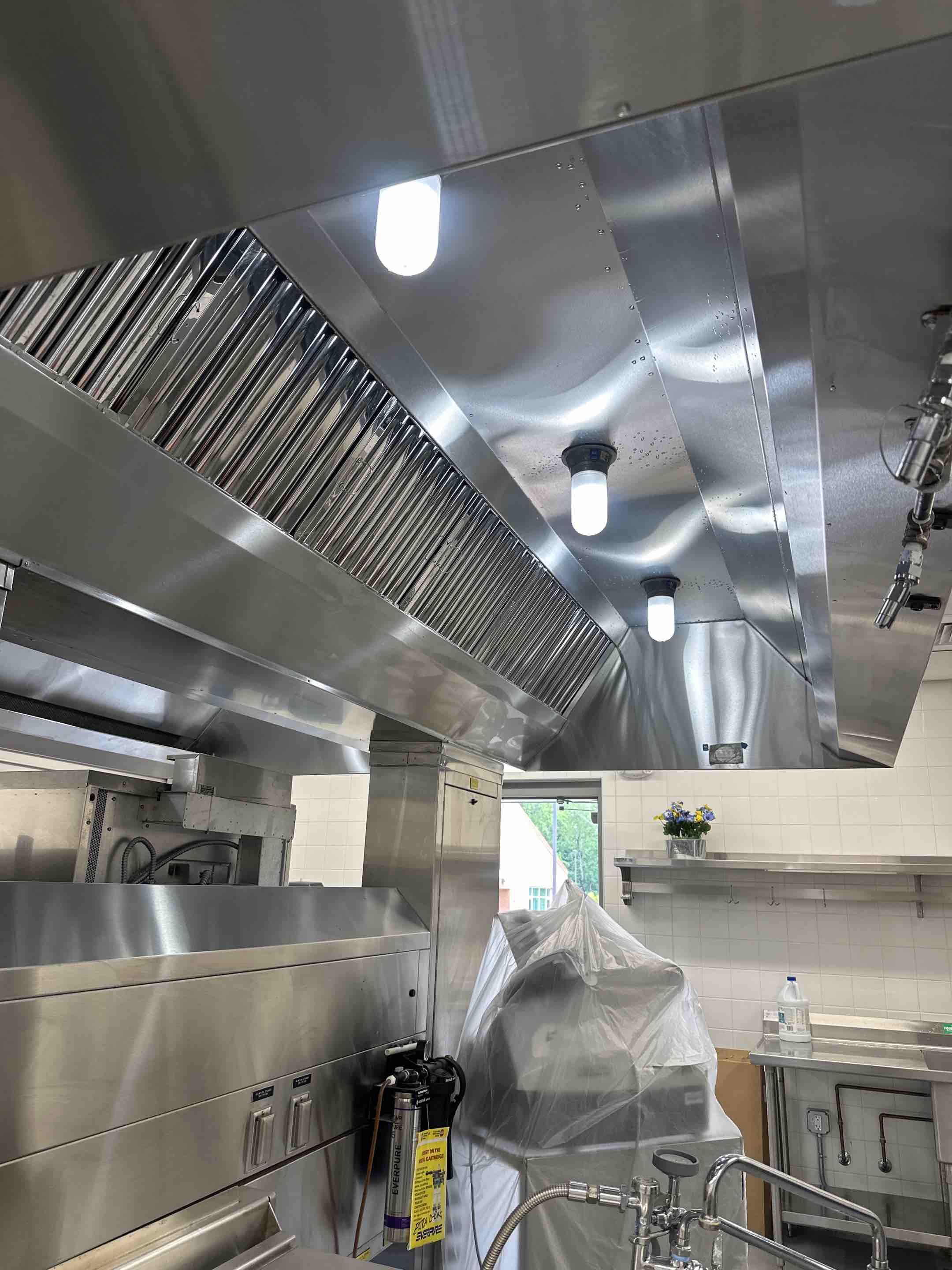 A thorough deep cleaning of the kitchen hood was performed, ensuring all grease, grime, and food particles were meticulously removed. The process began with a pre-cleaning inspection to identify areas requiring special attention. High-efficiency cleaning agents were applied to dissolve stubborn grease buildup.The filters were washed Post-cleaning, a thorough inspection was conducted to confirm the effectiveness of the cleaning process. The final step involved a performance test to ensure the hood was operating efficiently.