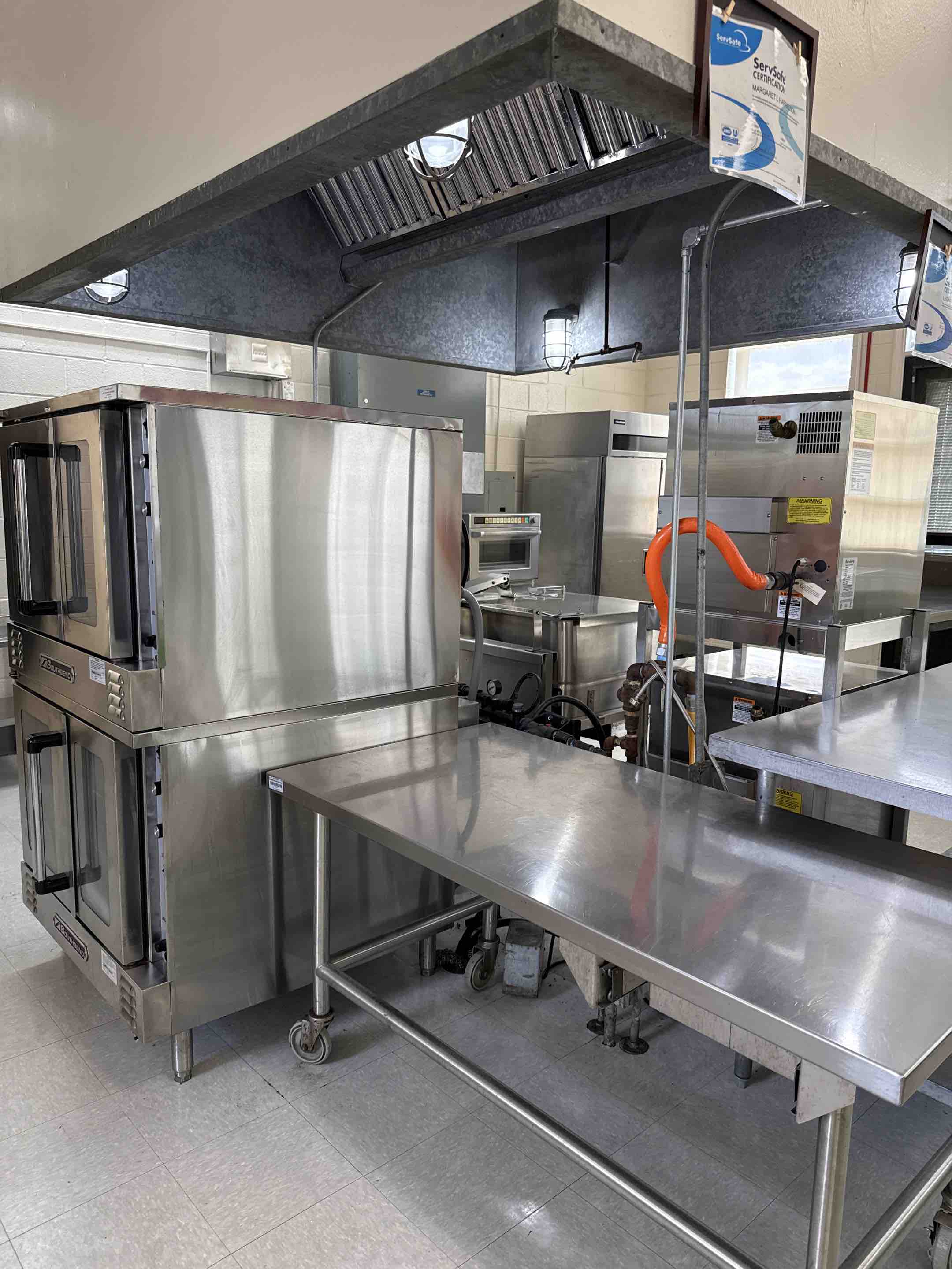 A thorough kitchen hood cleaning was performed, starting with a detailed inspection of the hood system. Grease and debris accumulation were assessed, and the appropriate cleaning method was selected. The hood's exterior and interior surfaces, including the baffles and filters, were meticulously cleaned using specialized cleaning agents and tools. Grease traps and ducts were also cleaned to ensure optimal airflow and efficiency. Post-cleaning, the hood's functionality was tested to confirm proper operation. The entire process was completed with attention to safety and efficiency, ensuring the kitchen hood operates effectively and safely.