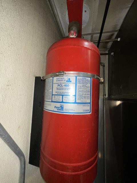 Completed the semiannual inspection and functional testing of the commercial kitchen fire suppression system. Checked the control head, agent cylinder, detection line, pull station, piping, nozzles, and fuel shutoff. Documented service results for local fire code compliance reporting.