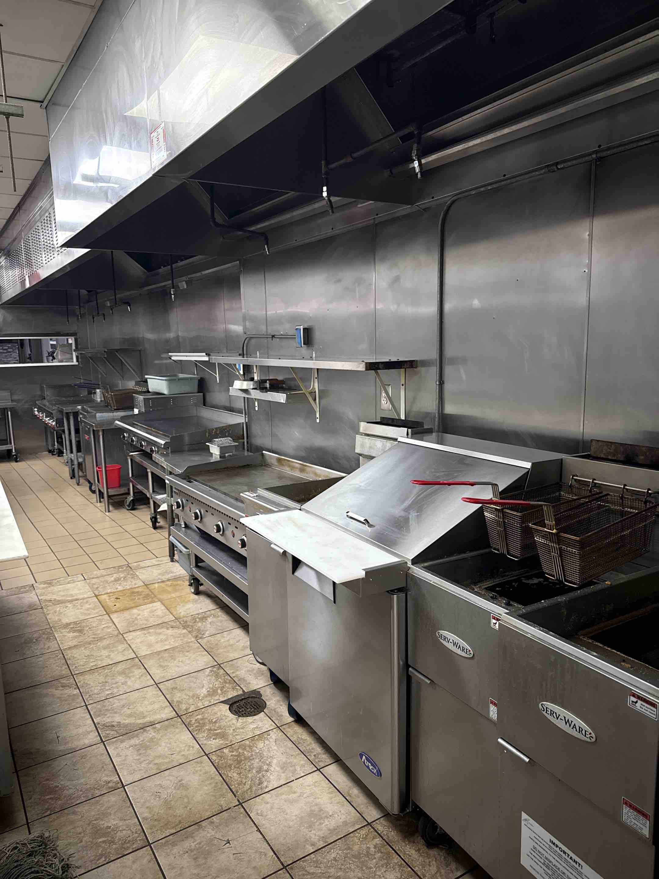 Performed a comprehensive commercial kitchen hood cleaning to support full NFPA 96 code compliance and fire safety standards. Conducted a detailed initial inspection of high-grease areas, then deep-cleaned and degreased the entire exhaust hood interior, exterior, and sanitizing grease filters. Inspected ductwork for dangerous blockages and airflow obstructions, while thoroughly cleaning the exhaust fan and motor assembly to ensure optimal ventilation performance. Completed a final inspection to verify complete grease removal, proper mechanical function, and compliance with local fire codes.