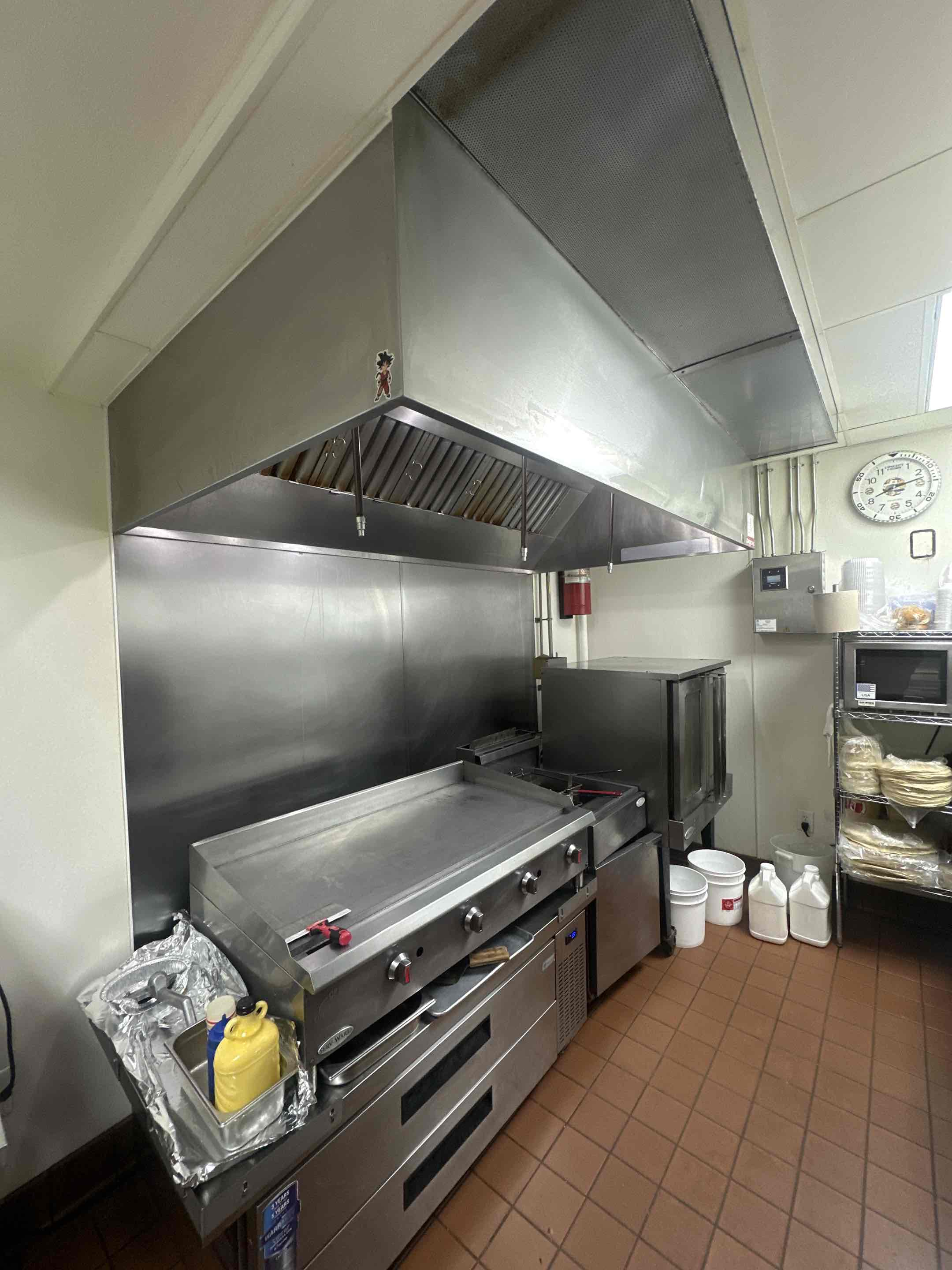 A thorough kitchen exhaust cleaning service was performed, starting with a detailed inspection of the entire system. This included the ductwork, fan, and filters. The ductwork was carefully vacuumed to remove accumulated grease and debris, ensuring a clear airflow path. The fan blades were disassembled and cleaned to eliminate any buildup, enhancing efficiency. Filters were removed, cleaned, and replaced as necessary. The exterior vent cover was also cleaned to prevent outside contaminants from entering. The process concluded with a final inspection to confirm the system's cleanliness and optimal performance. This comprehensive service ensures a safer, healthier kitchen environment.
