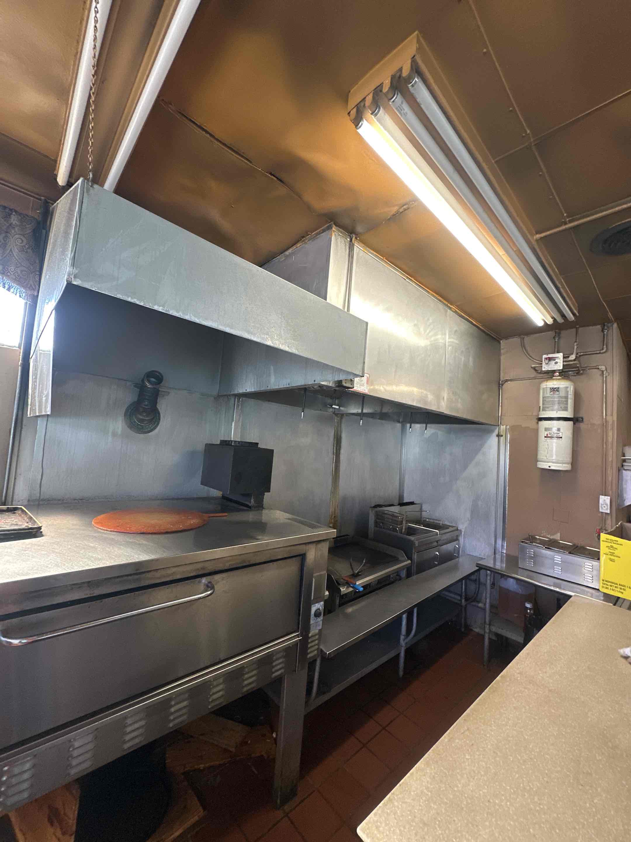 A thorough cleaning of the kitchen exhaust system was performed, ensuring optimal performance and safety. This involved meticulous removal of accumulated grease and debris, which can pose significant fire hazards if left unchecked. Following the cleaning, a fire suppression system check was conducted to confirm its readiness and functionality. This included testing the system's response time and ensuring all components were in working order. After completing the kitchen tasks, a comprehensive inspection of fire extinguishers was carried out. Each extinguisher was checked for proper pressure levels, unobstructed access, and operational functionality. All equipment passed inspection and was certified, ensuring the safety and compliance of the premises.