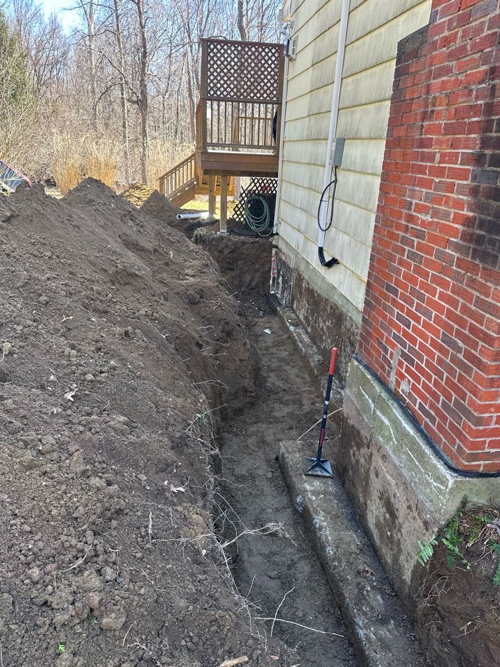 Footing drain installation on this home to help with water coming in through the foundation  Footing drain installation on this home to help with water coming in through the foundation