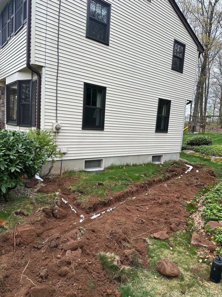 Installed  some gutter downspouts underground to discharge into rip rap  