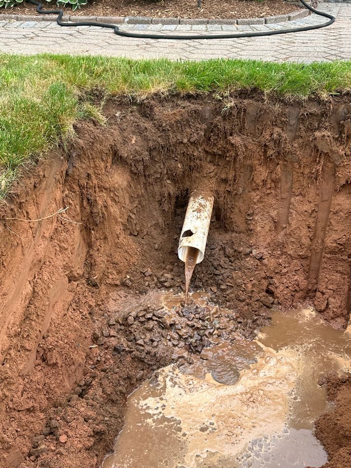 Fixed a improperly draining downspout and installed a drainage leaching area for it 