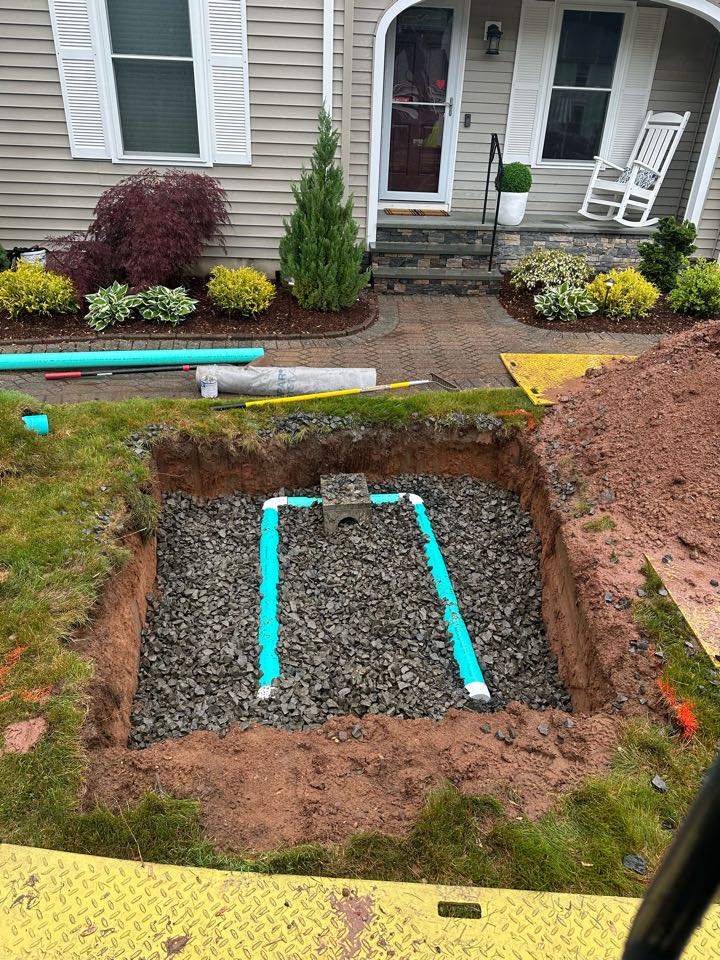 Fixed a improperly draining downspout and installed a drainage leaching area for it 