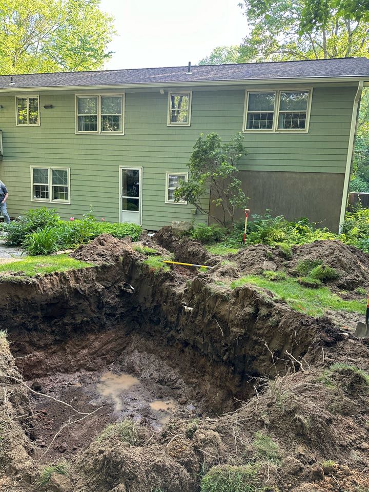 Hole dug for a septic tank to be installed tomorrow and leachfiejds scarified for inspection before filling in with septic sand !