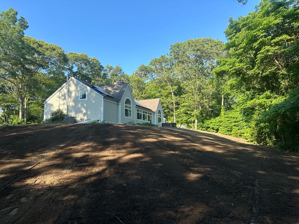 After taking about 2 to 3 feet off the hillside and spreading for tri axles of topsoil. This yard is ready to be Hydroseed tomorrow!