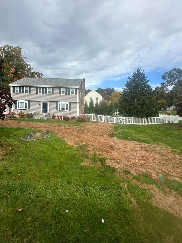 Gave the yard some time to settle after a drainage job and gave it a topping of topsoil before it gets Hydroseed