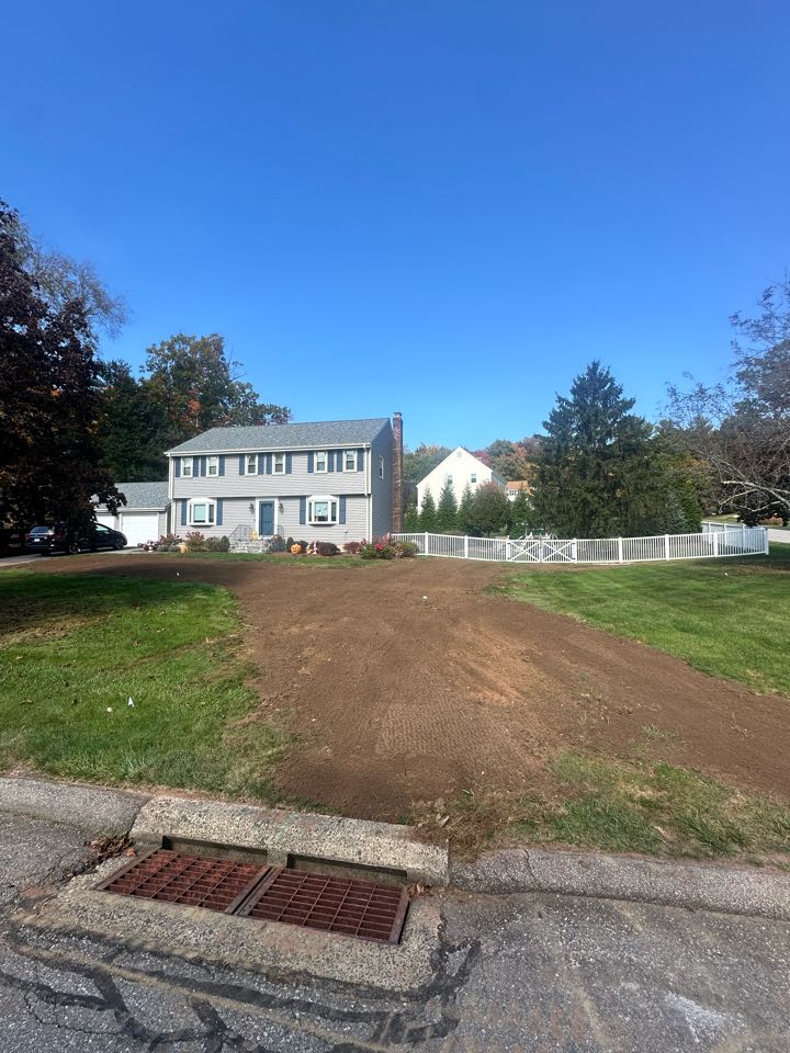 Gave the yard some time to settle after a drainage job and gave it a topping of topsoil before it gets Hydroseed