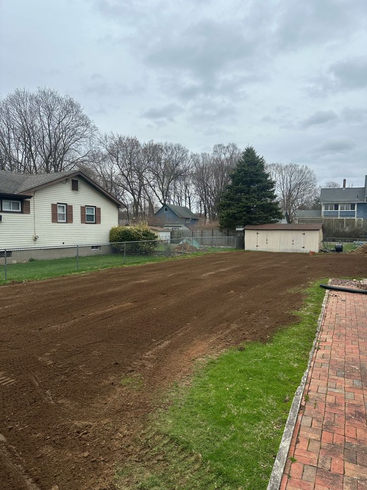 Back in the fall, we did a septic system for this customer and they had us come back today to do a fresh coating of topsoil with the rock hound to get it nice and level!