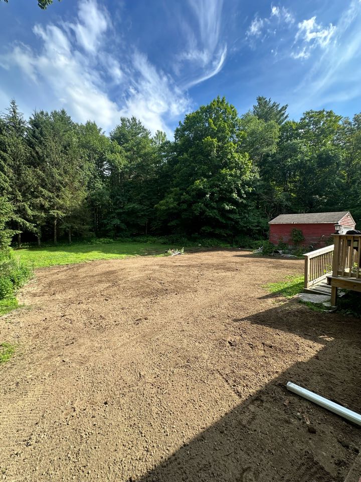 Topsoil and seed spread over the new system !