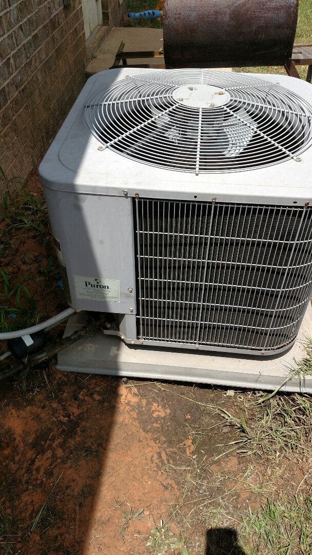 Repairs on a Carrier heat pump.