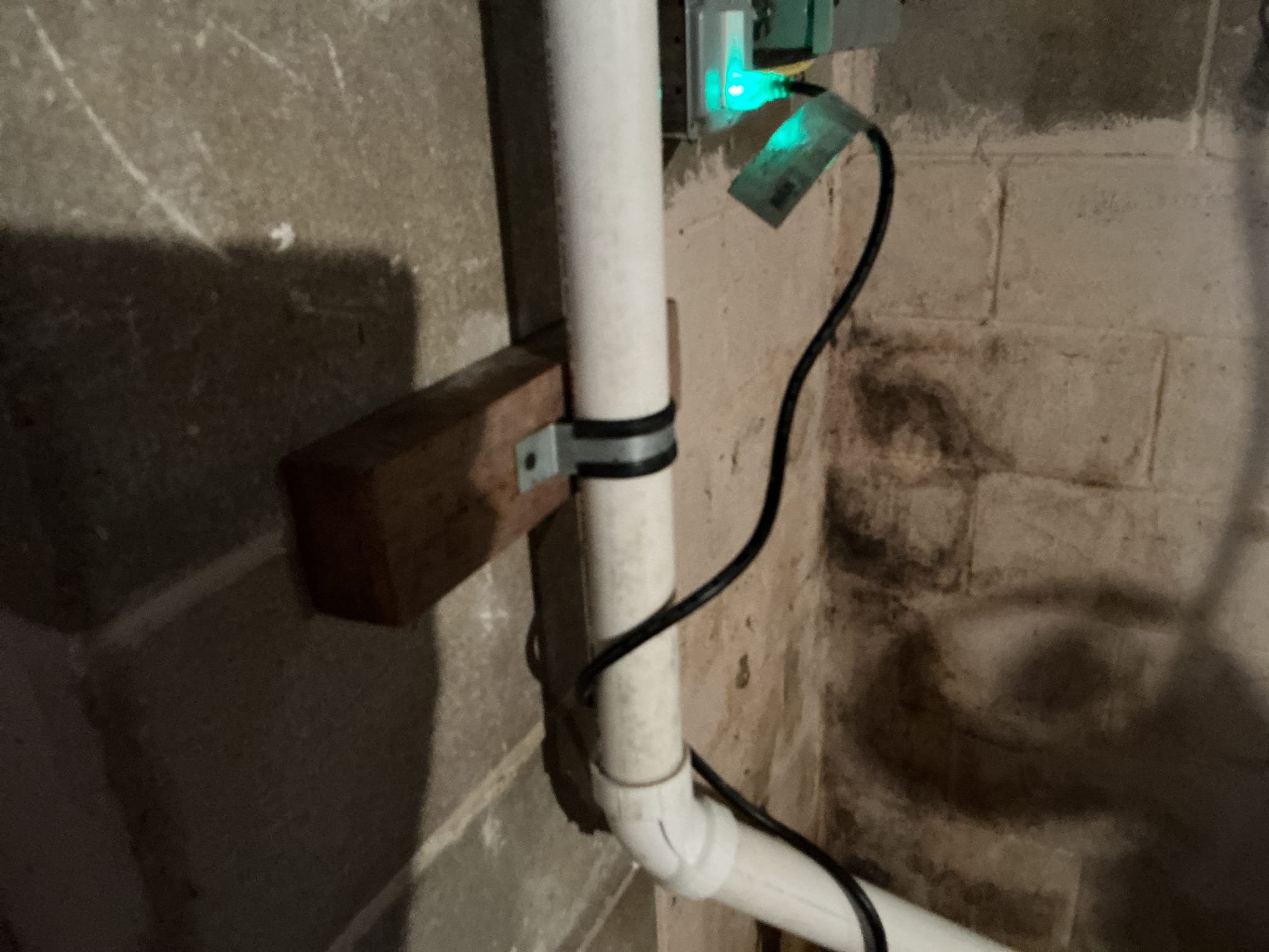 Arrived back to the home to finish the install of the sump pump. I supplied and installed the pit cover for the client and secured my connections. Lastly, I drilled into the concrete block for the wood to be secured to. Supplied and installed galvanized strap for the client, and siliconed the outside termination for the client as well. Arrived back to the home to finish the install of the sump pump. I supplied and installed the pit cover for the client and secured my connections. Lastly, I drilled into the concrete block for the wood to be secured to. Supplied and installed galvanized strap for the client, and siliconed the outside termination for the client as well.