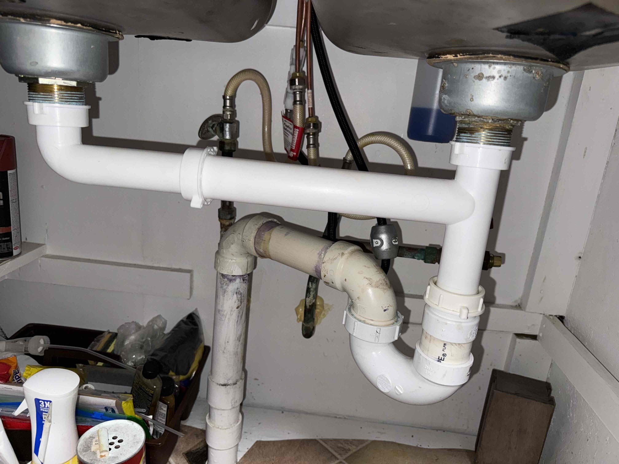 Upon arrival customer explained that there is a leak under the kitchen sink sound coming from a toilet and a sound coming from washing machine random upon further inspection we discovered that there is just water dripping from hose connected to relief valve in the toilet tank causing the sound of the toilet could not re-create sound with washing machine so unable to diagnose issue at this time customer will call back if sound persist in to address leak under kitchen sink we replace trap assembly. All work was tested for leaks and proper function. All work functions properly in their load. No leaks found at this time.