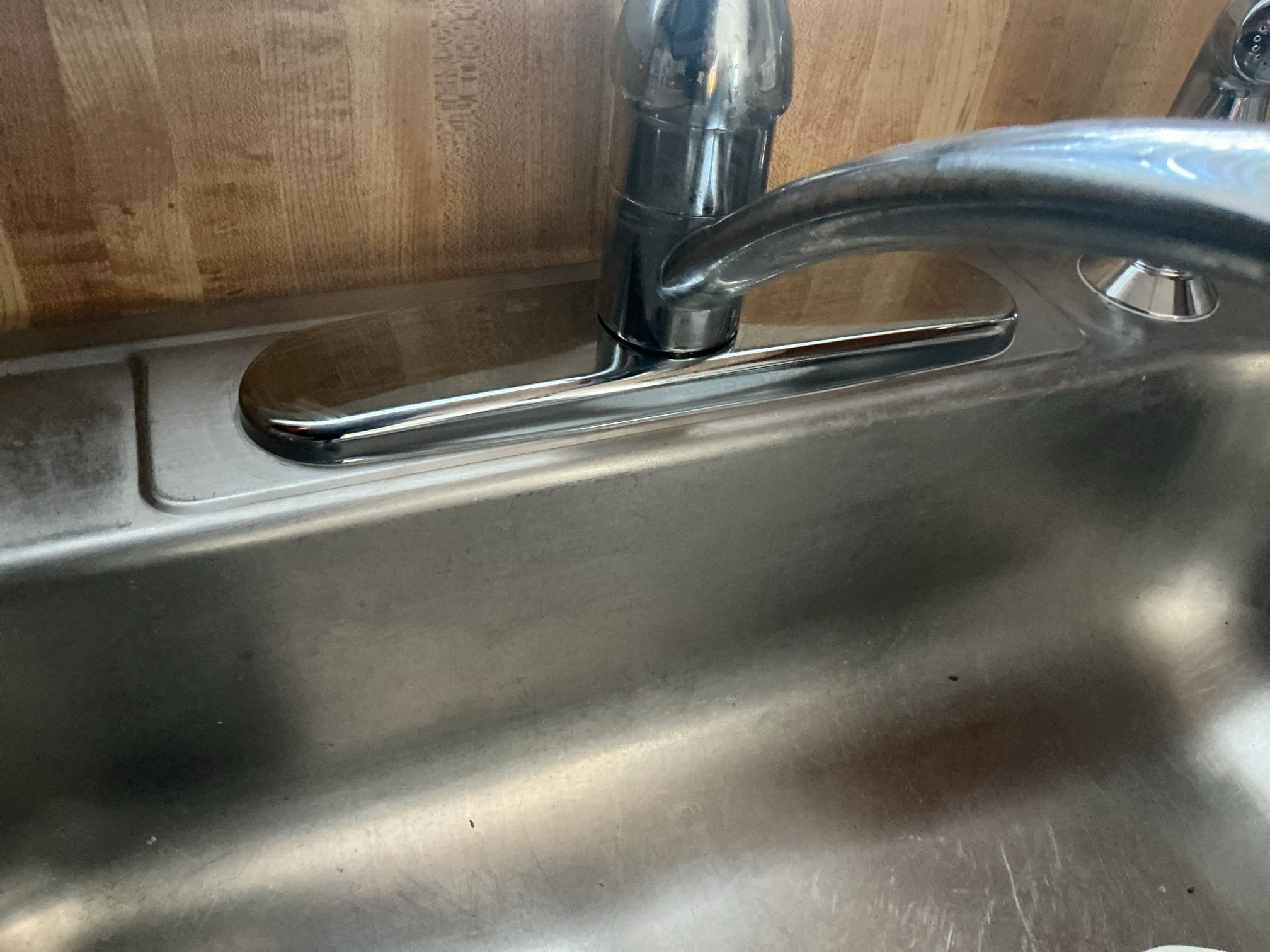We had recently had preformed an annual plumbing inspection, at the time of inspection I replaced the washing machine valves, also tightened tubular connection under kitchen sink. We arrived because client thought there was a leak under their kitchen sink, after a thorough evaluation I discovered is actually coming from the deck plate of the faucet. If water touches the faucet it leaks from underneath. For today I placed caulking around all the trim and deck plates to insure a water tight seal. I advised to the client if it keeps leaking replacement of faucet would be recommended. If client calls back to replace faucets I will credit today’s diagnostic fee towards the work. I caulked around bathroom faucet as well as per the client. 