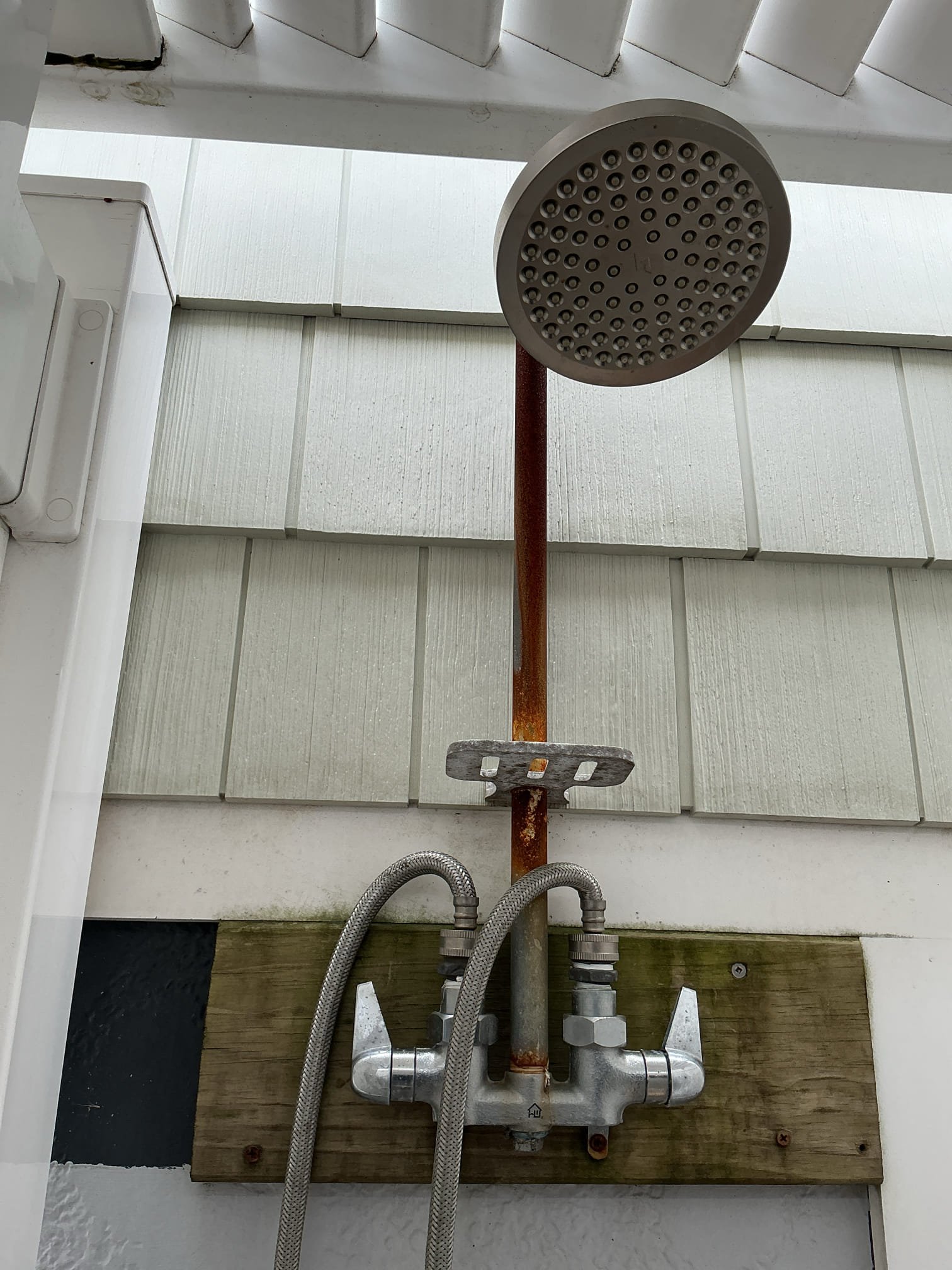 Shut off valves for system located under kitchen sink.
Drained down the system.
Disconnected and removed existing rinse station from the home.
Supplied and installed new hose bib both hot and cold that provide water to the rinse station.
Minor repipe preformed under home.
Supplied and installed new Matco Norca outdoor rinse station.
Secured station to the home.
Supplied and installed new washing machine hoses for the station.
Secured those connections and turned the water back on to check for leaks.
There are no leaks at this time.
After completion, disconnected and shut off valves under sink to winterize the system.
Disconnected drain plug and new hoses and gravity drained the system.
System is now winterized.