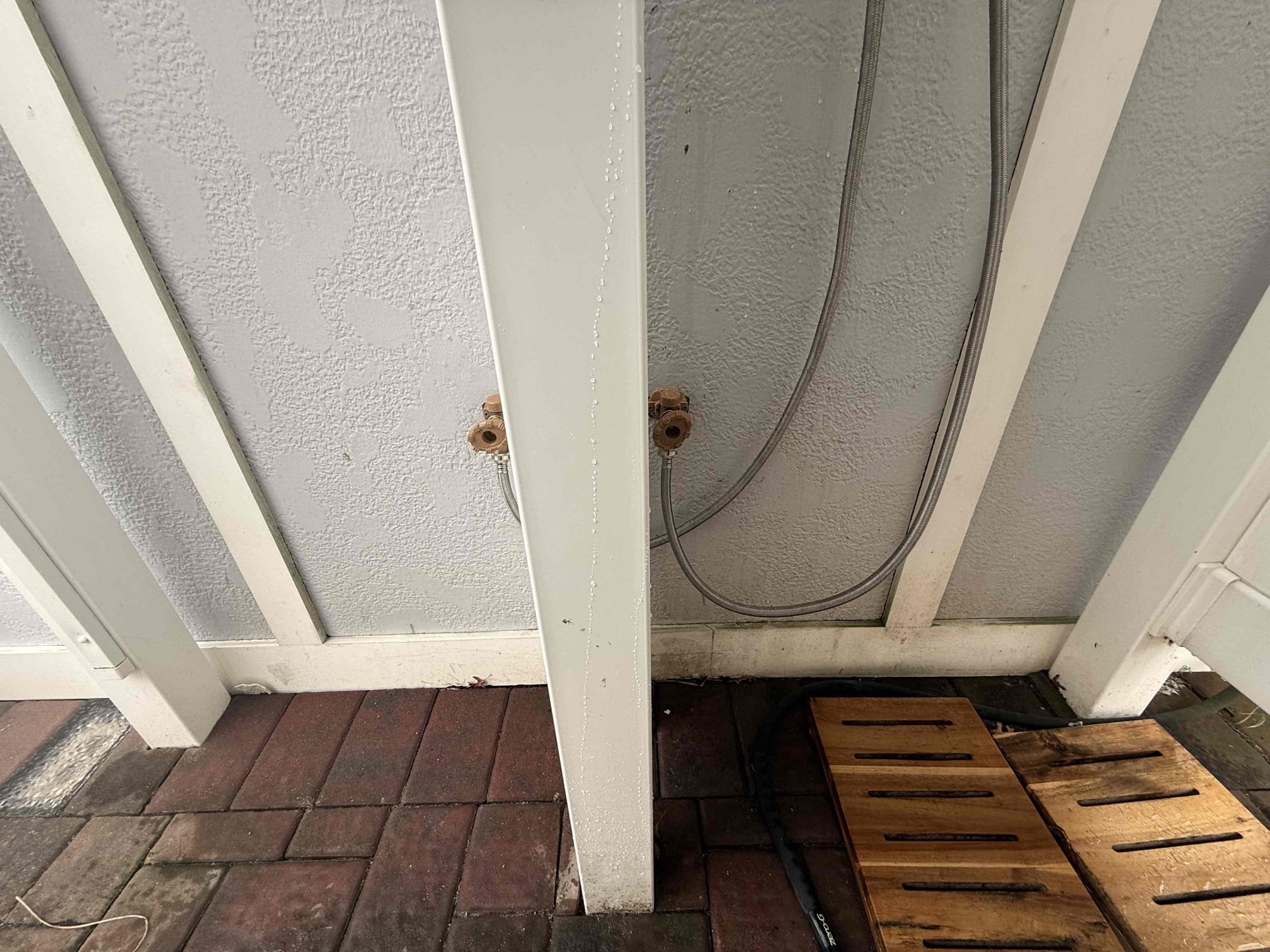 Shut off valves for system located under kitchen sink.
Drained down the system.
Disconnected and removed existing rinse station from the home.
Supplied and installed new hose bib both hot and cold that provide water to the rinse station.
Minor repipe preformed under home.
Supplied and installed new Matco Norca outdoor rinse station.
Secured station to the home.
Supplied and installed new washing machine hoses for the station.
Secured those connections and turned the water back on to check for leaks.
There are no leaks at this time.
After completion, disconnected and shut off valves under sink to winterize the system.
Disconnected drain plug and new hoses and gravity drained the system.
System is now winterized.