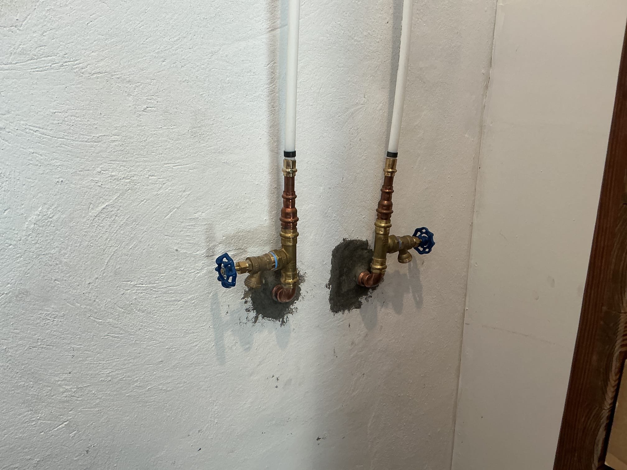 We had recently installed a customer supplied outdoor rinse station for the client, we arrived today to winterize the system.
Located shut off valves for the system under the kitchen sink.
Introduced pressurized air through winterization station in garage. 
Blew out air on both hot and cold side.
Left boiler drain valves on and removed handheld and shower heads.
System is now winterized for season.