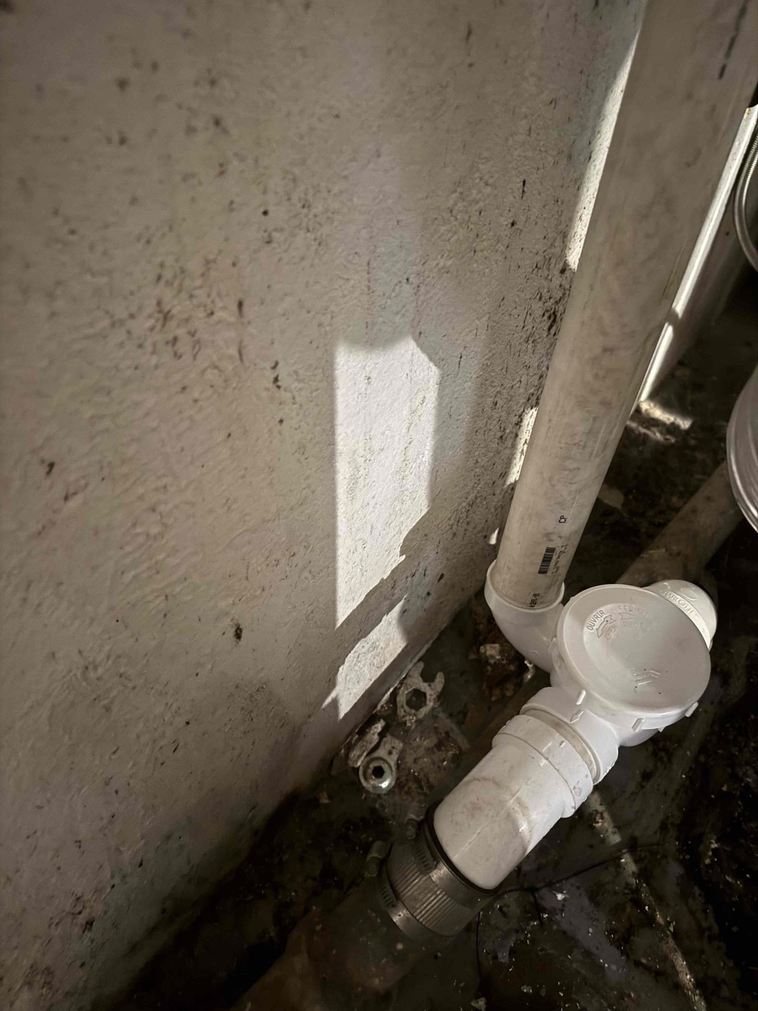 Arrived on site removed leaking section of cast iron and installed new piece of pvc into cast iron hub and used oakem and plastic seal to secure it in place. Installed new check valve trap and stand pipe for washing machine. Tested all work and everything appears to be in working order and there appears to be no leaks at this time. Collected payment.