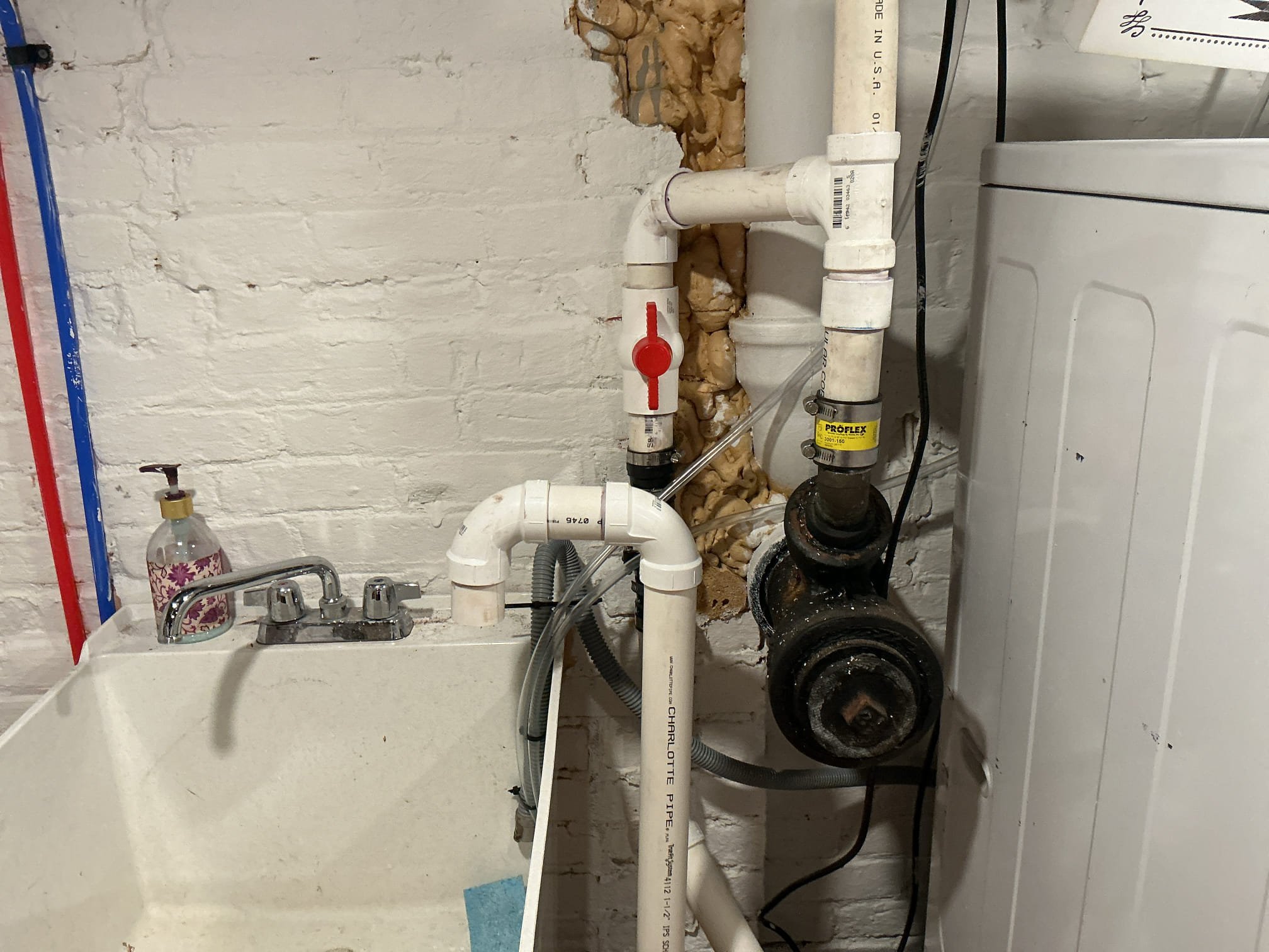 We had recently pulled a permit for an existing laundry sink with a pump in the basement for our client, as per our drawing, we had failed inspection due to there not being a full service ball valve on the discharge and the vent not being connected back to be above the existing sink. Also the condensate piping for the furnace and water heater were to short.

Supplied and installed new full service ball valve for the pump.
Supplied and installed new pvc pipe and fittings to make the vent correct.
Supplied and installed new vinyl tubing for both furnace and water heater and strapped the tubing.
Secured my connections and ran water to check for leaks on the sink.
There are no leaks at this time.

*While on site, client ask if I could attempt to tighten down their existing widespread lav faucet due to it being loose. I attempted to tighten it but the connection will not secure properly due to the gasket being warped. Advised client to replace the faucet.