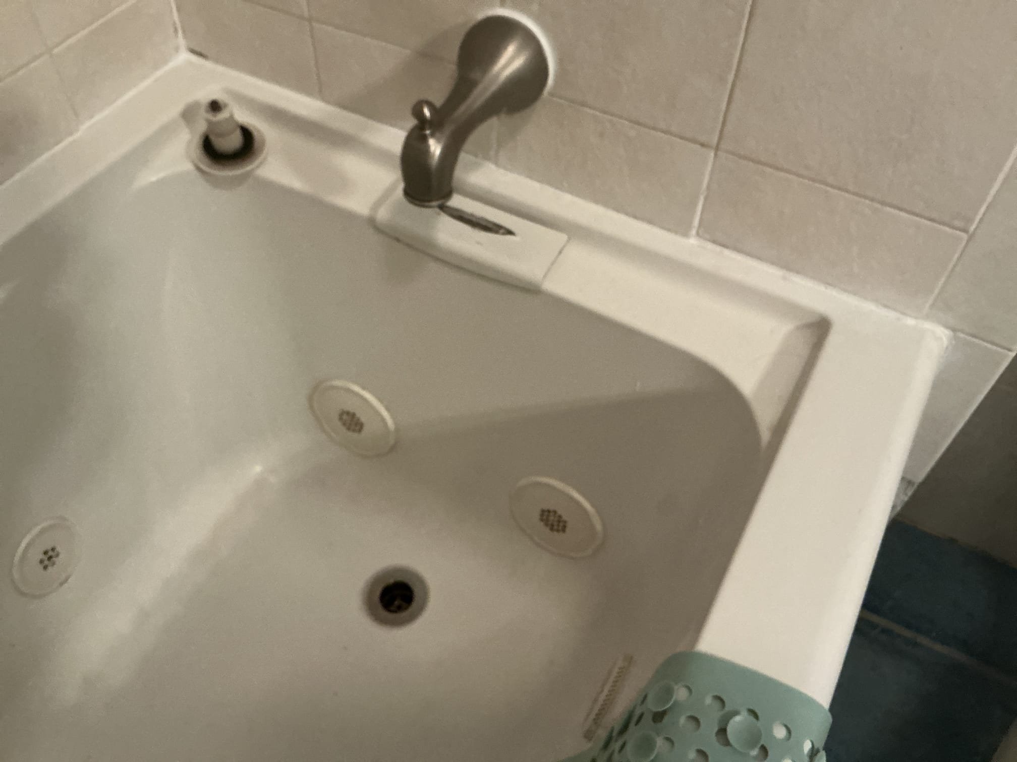 Arrived to the home, customer states there is a leak from the upstairs bathtub going down to the kitchen ceiling, customer has already cut open a hole for me. The existing bathtub is an American Standard soaking tub with jets and a special order tub waste and over flow. I ran water to determine the cause of where the leak is coming from, there are no leaks coming from the tub drain or the trap for the tub. I next poured water on the overflow plate and water started to leak from below. I advised to the client that I can order this specific tub drain for them and come back to install it, but in order to install the drain, I would need to demo the tile in the adjacent shower in order to get access to the piping or removal of the tub completely. Client is aware of this, the cause of the leak is the rubber gasket for the overflow appears to have dry rotted. 