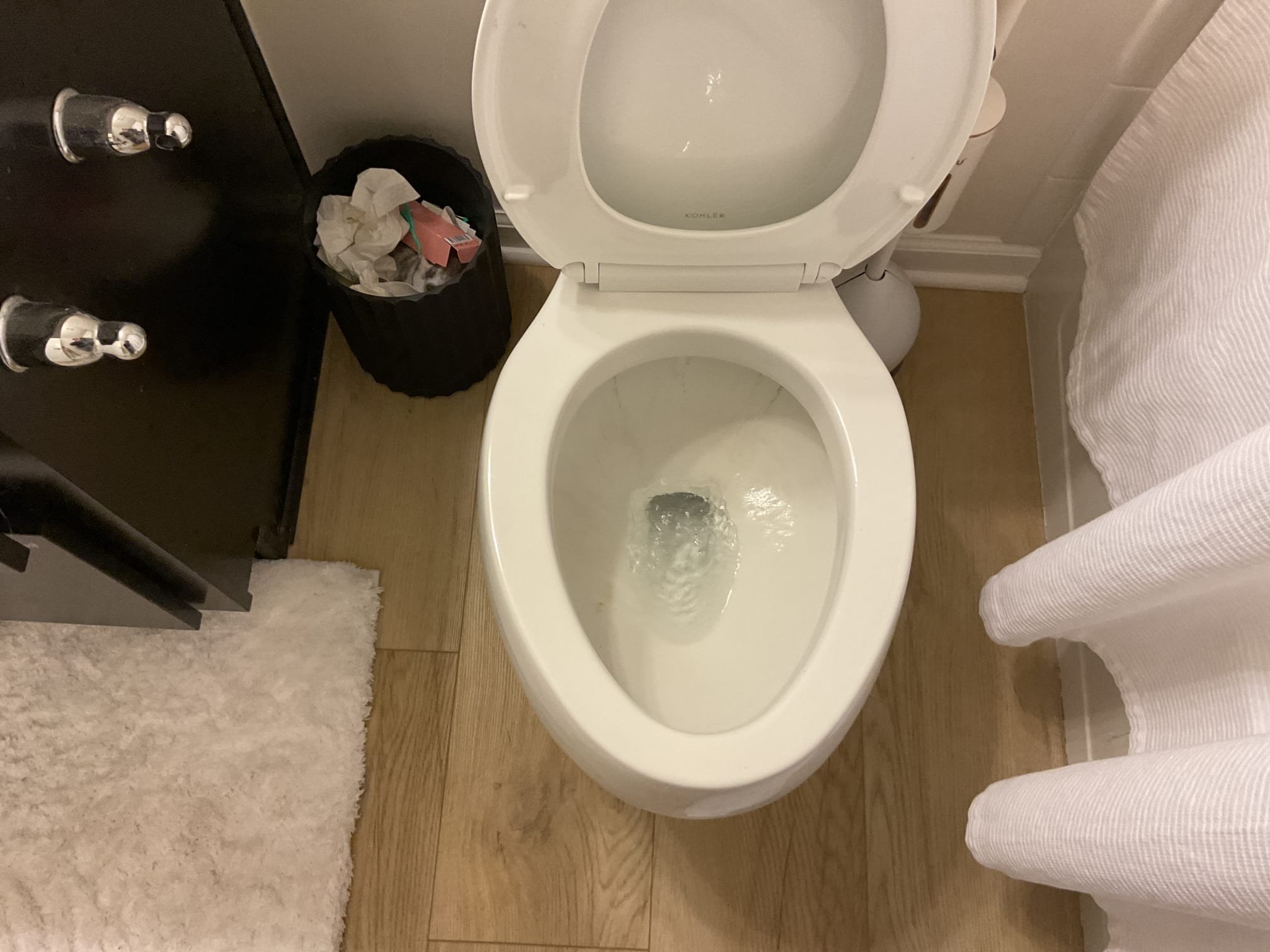 Arrived on site customer stated that they have clogged toilet. Upon inspection found that the toilet was clogged and customer stated nothing was dropped in the toilet. Gave options and customer would like us to auger the toilet. Sent down auger and hit a hard blockage and was able to remove it flushed toilet multiple times and everything appears to be on working order and there appears to be no leaks at this time. Collected payment.