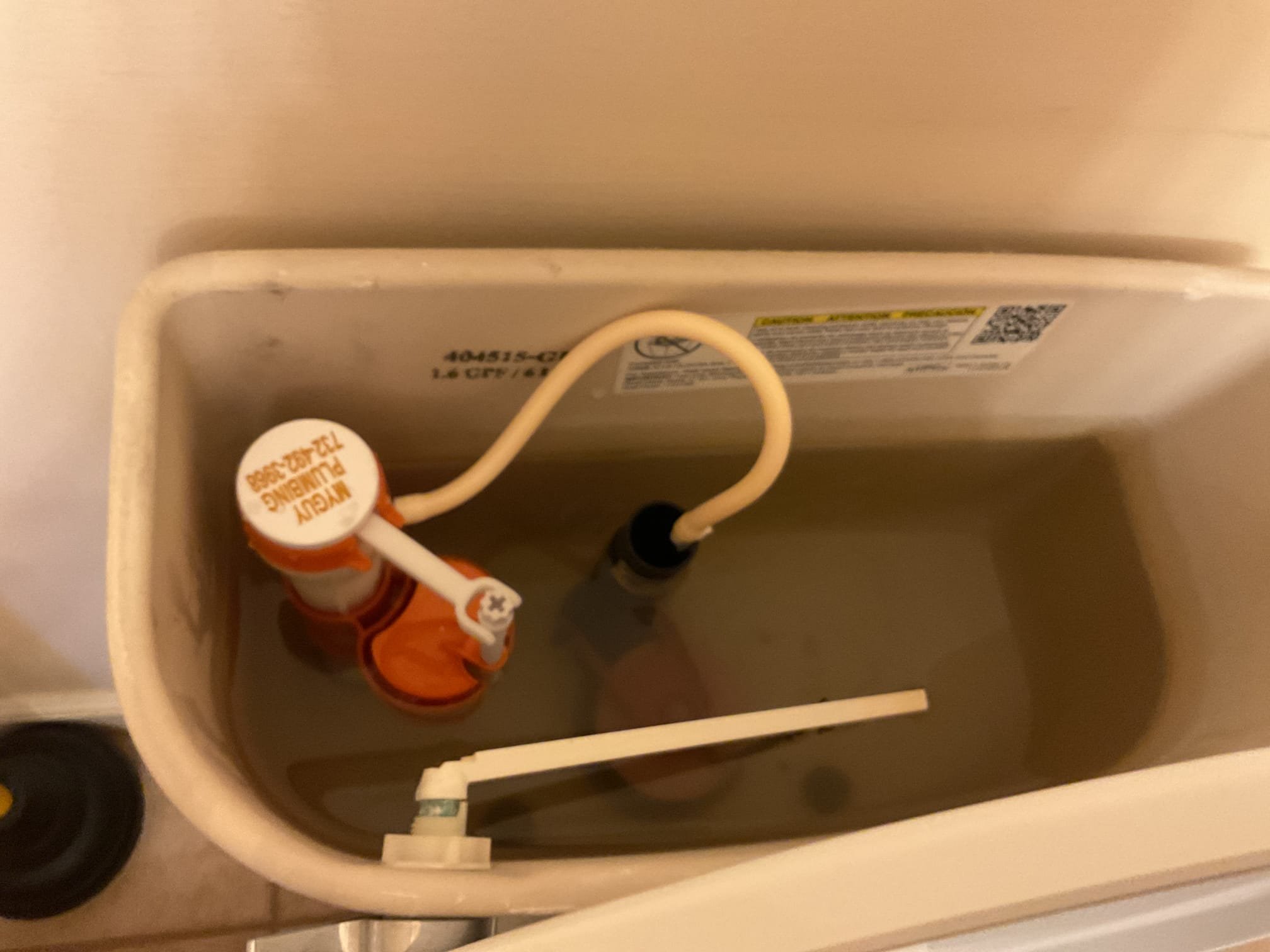 Arrived on site customer stated that the fill valve was making a whistling sound it’s appears that something had gotten lodged in the fill valve after shutting the water off as a courtesy replaced the fill valve. There appears to be residual water in the pan from initial install it was noticed the day after install and has not progressed since then wipe up water and left rag in pan to collect any residual water that may seep out the water is not hot so it does not appears to be the tank itself leaking. Told customer to keep an eye on it for the next week or two and check to see if it gets worse. If it is persistent we will replace the tank.