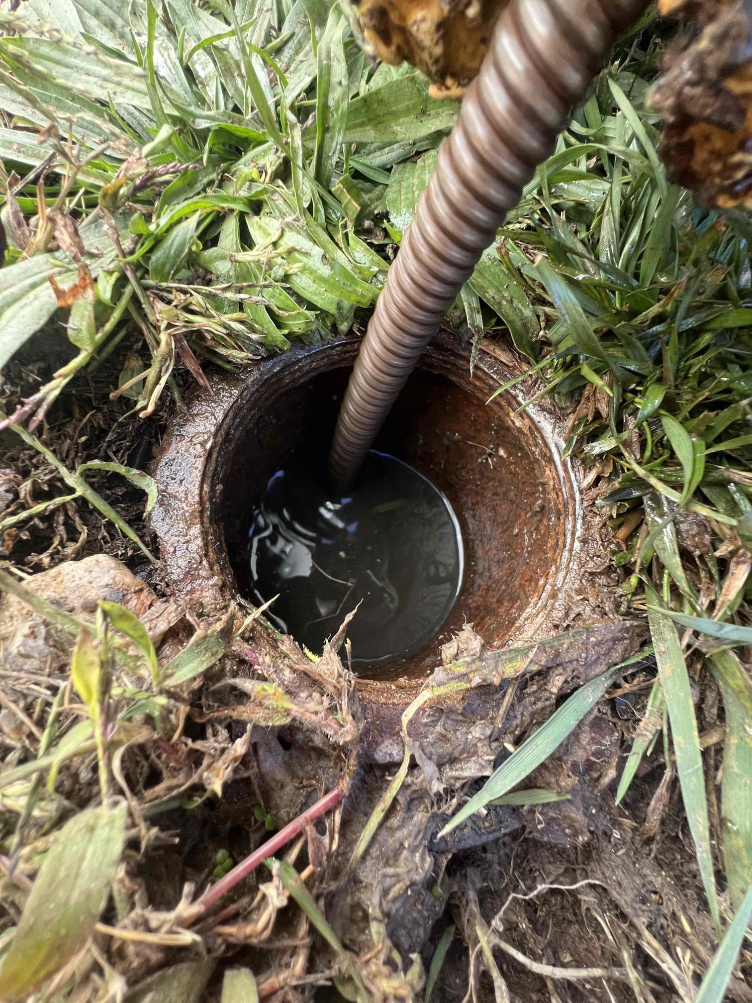 Arrived on site client stated his main line was clogged and had another plumber out that could not restore flow. Client had a cleanout in the back of the home where we attempted to snake from. After restoring flow we put a camera down the line and found another cleanout in the front of the home. Clients main is piped in pvc from the house towards the street and appears to be in good condition but there are just a lot of turns which reduces flow.