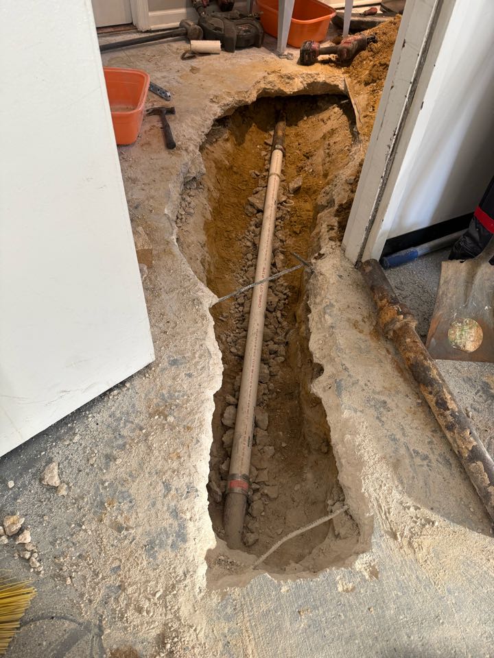 Repaired pipe in slab