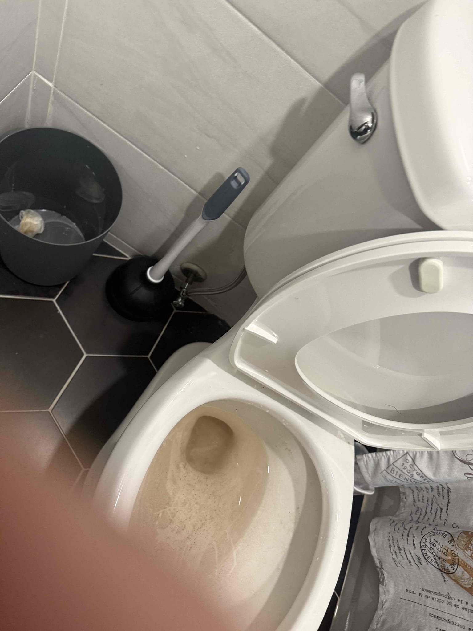 Arrived on site customer stated that they had a clogged toilet. Upon inspection found that some had tried to auger it previously and scratched the porcelain. Gave options on repairs and customer would like to try and auger it again sent down auger and was able to push past the blockage and was able to slightly restore flow to where it would drain out but not flush. Pulled toilet and remove toilet paper from trap and reset toilet. Cleaned toilet and tried to remove scratches the best I could. Tested all work and everything appears to be in working order and there appears to be no leaks at this time. Collected payment 