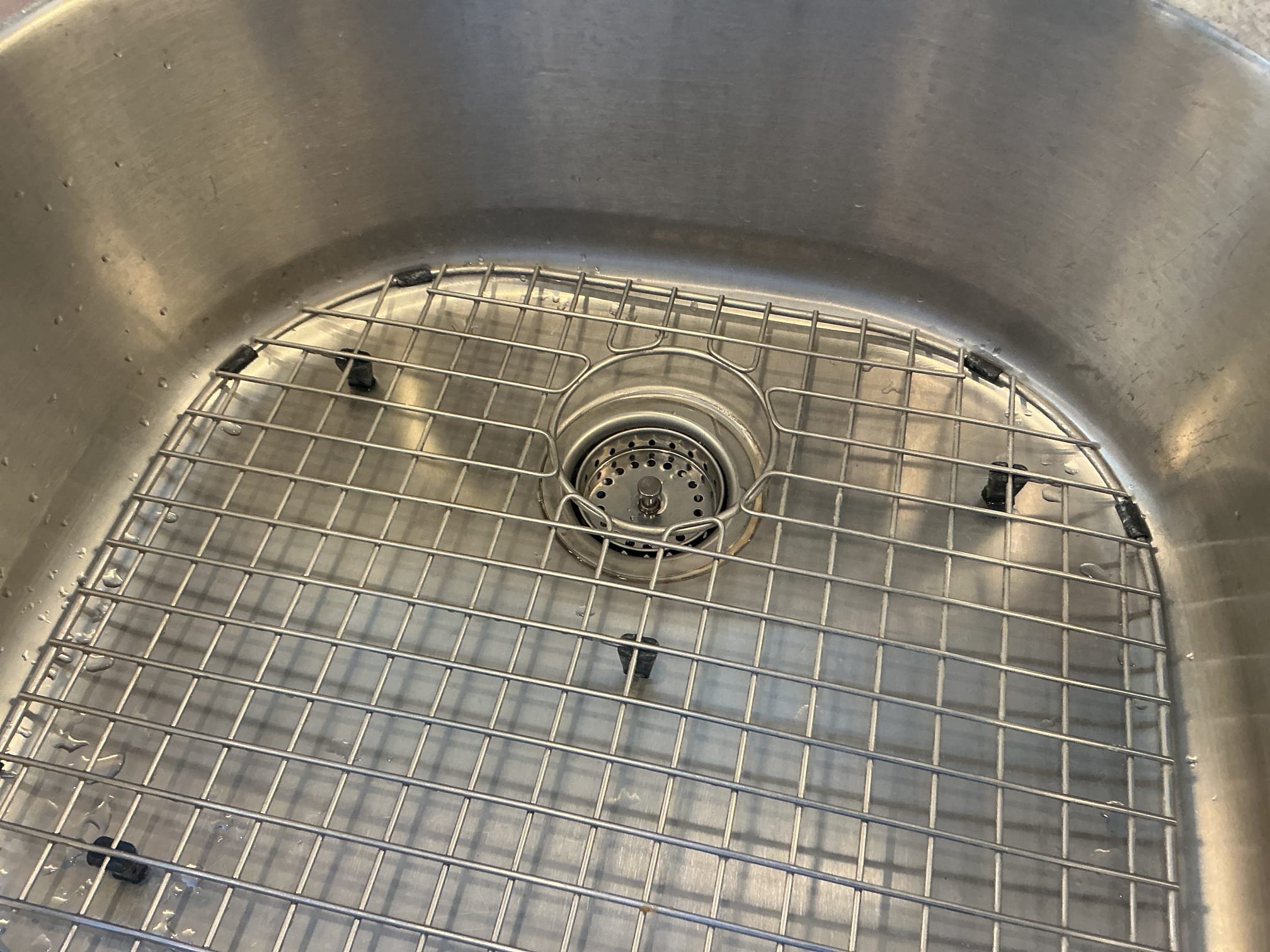 Cut drain in basement.
Supplied and installed new pvc pipe and cleanout fitting in the basement for future service of building drain.
Adapted to existing copper using no hub connections.
Secured connections and ran fixtures in the home to check for leaks.
There are no leaks at this time.

Supplied and installed new basket strainer for the right bowl on the kitchen sink.
Secured those connections and pressure tested sink to check for leaks.
There are no leaks at this time.
Removed carbon filter and tap on kitchen spread.
Installed new sink hole covers and relocated the soap dispenser for the client.

*We had recently replaced all the toilets in the home, client states a small leak under one of the toilets. After a full evaluation I discovered that the new shut off valve I supplied appears to be defective with a minor leaks coming from the threads. I replaced the valve and checked for leaks, I then noticed the the 3/8 brass nipple had broke, Replaced the supply line, nipple, and valve fo