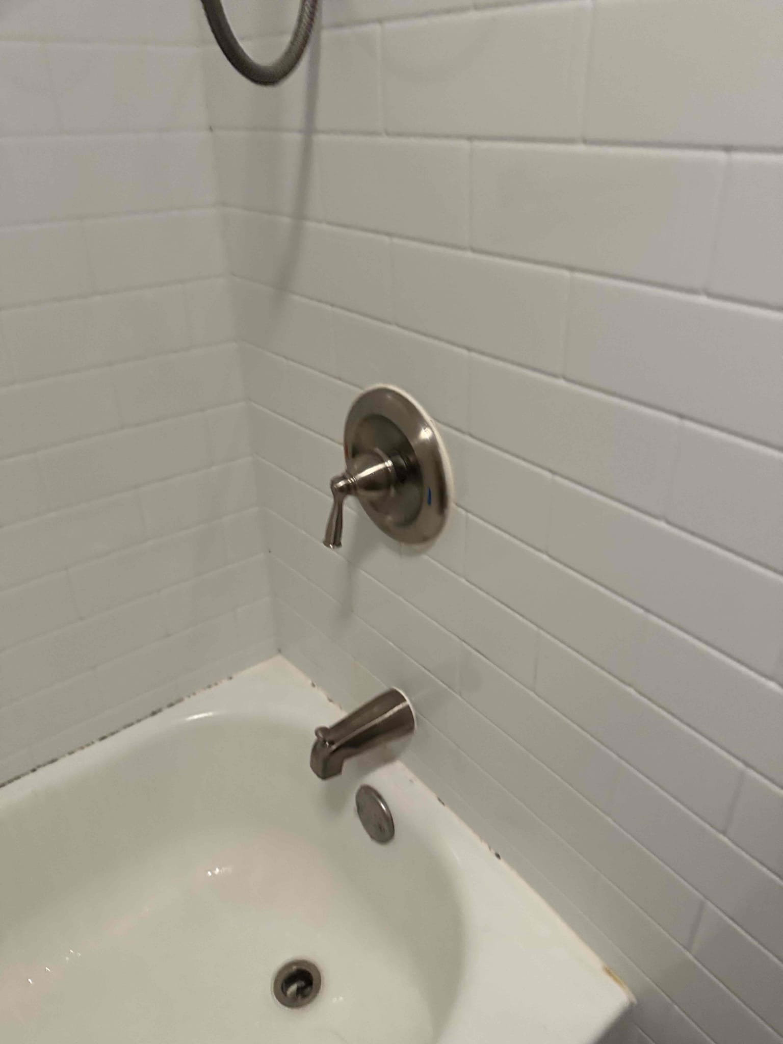 Arrived at customers home for a leaking tub spout and for the shower head leaking while tub spout is on. After diagnosing the problem and presenting options we replaced the tub spout. We installed a brand new brushed nickel tub spout and re caulked. After replacement the tub spout is working as intended.

While the tub spout is on, there is still water coming from the shower head. This is most likely due to the tub spout being run in PEX, which is incorrect. I left the customer with options if they choose to rectify this problem in the future.