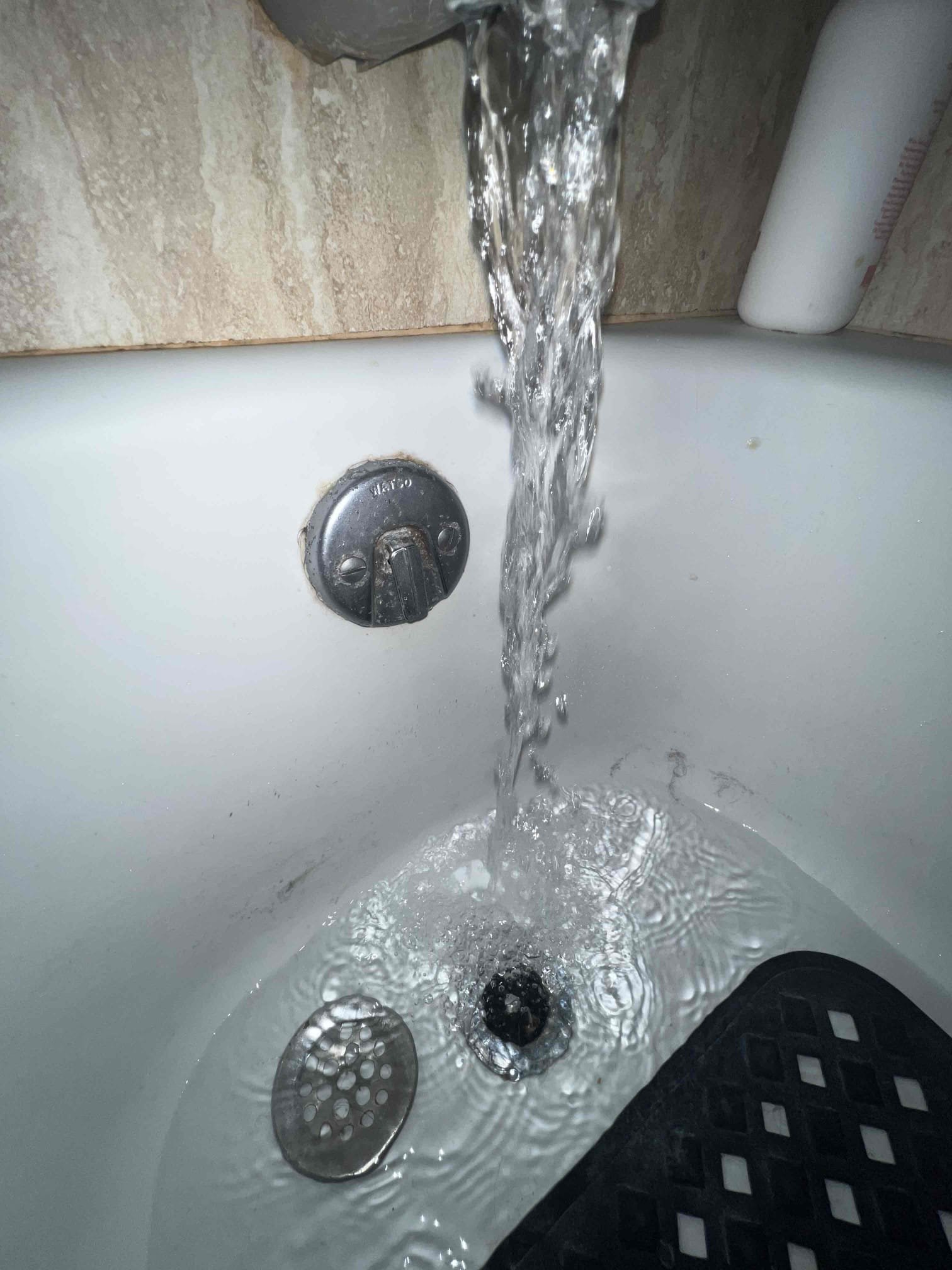 Arrived on site and client stated their tub was not draining. Upon inspection the tub is draining fine but the lever on the overflow needs to be pushed in in order for the tub to drain. Left estimates to replace tub waste and overflow. Home is on a slab and wall must be cut open to gain access to tub waste and overflow.