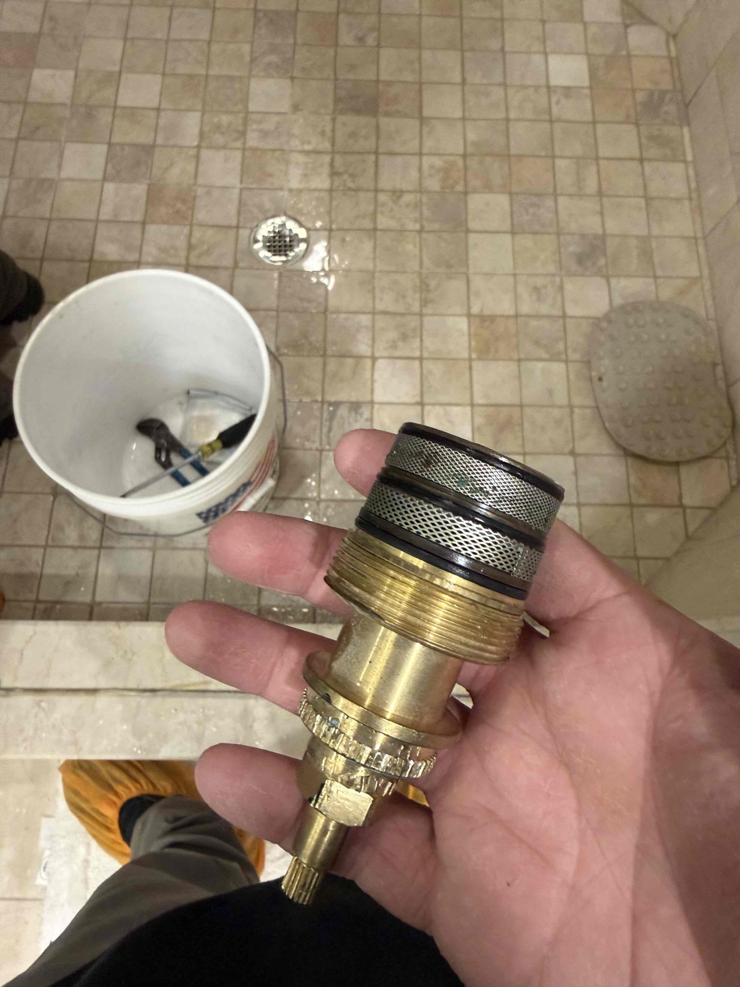 Arrived on site customer stated that they have a wet spot in the ceiling. Upon inspection found that the attic above the wet spot is dry and the only wet spot is on the surface of the ceiling in the bathroom. Also noticed that the connection between the shower head and the shower arm had to streams of water spraying up but is not reaching high enough to get the ceiling wet. Recommend fixing the leak on shower arm. It could potentially be customer is taking long hot shower and the moisture is building up and causing the water stains in the ceiling and the fan in the bathroom is not working properly. Messed around with shower head and got the stream to spray upwards towards the ceiling recreating the issues the customer was talking about. Replaced shower head gasket and tested all work and everything appears to be in working order and there appears to be no leaks at this time. Waived diagnostic fee.